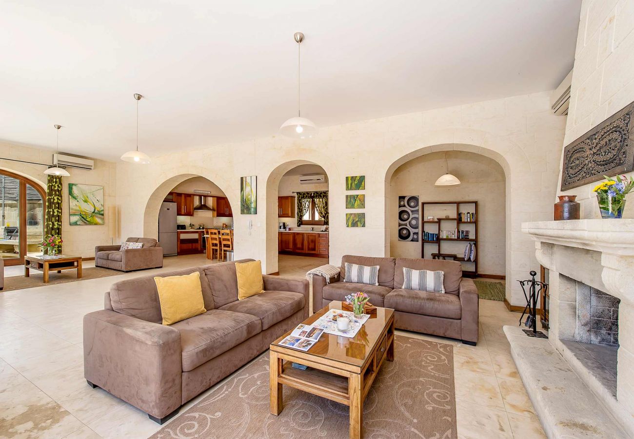living room of gozo villa with fireplace